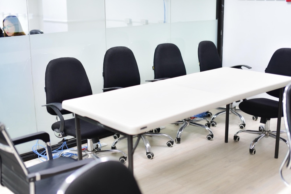 Boardroom with meeting table and chairs