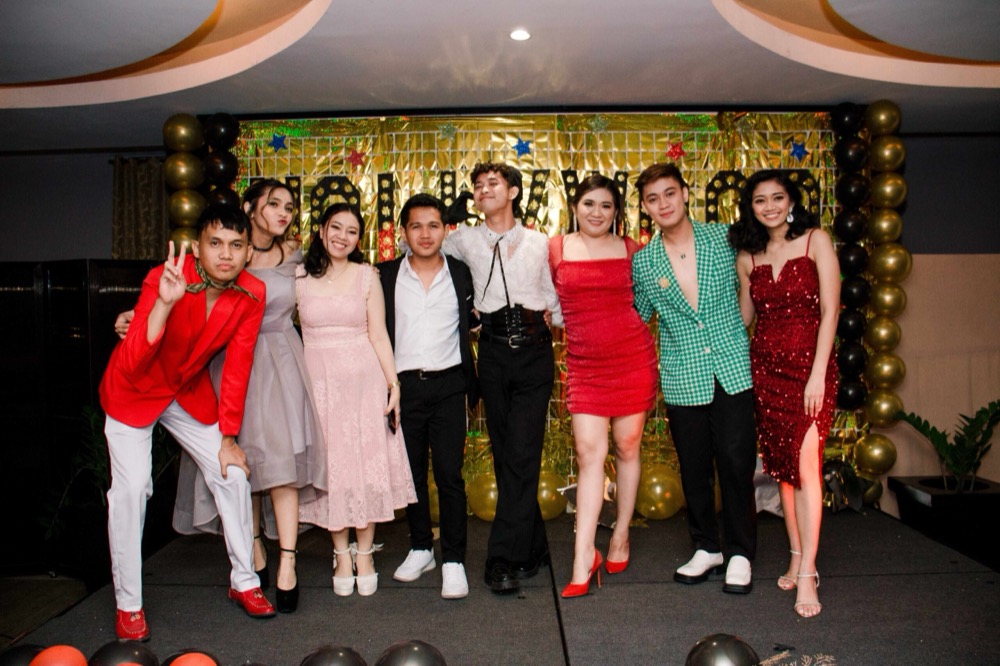 Team line-up on stage at the annual celebration