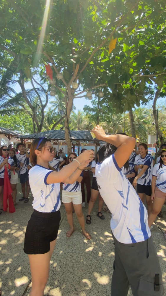 Team members competing in an outdoor team-building activity