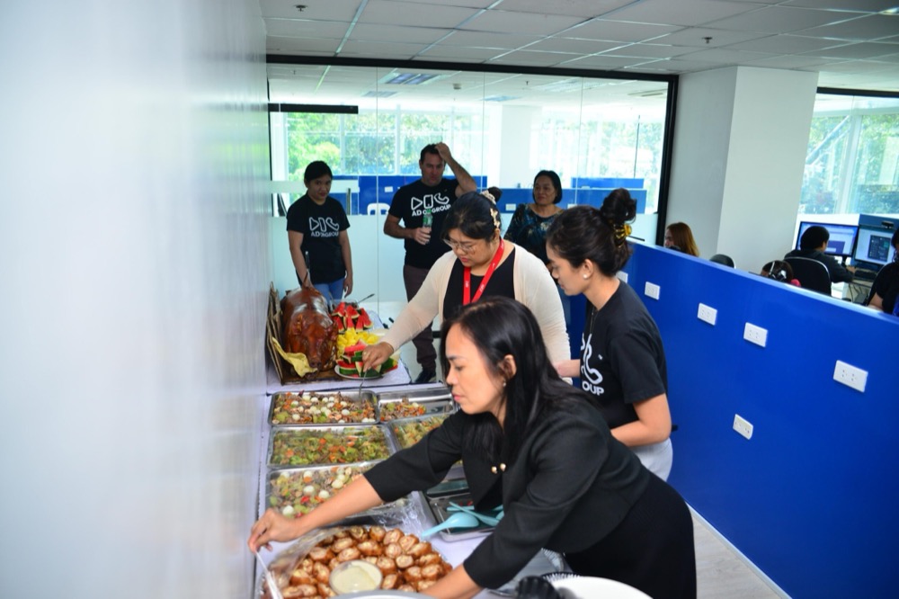 Colleagues sharing a catered lunch in the office