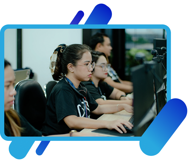 Offshore team members working at their monitors