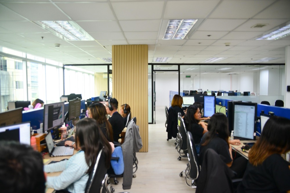 Staff at work on the office floor in the Philippines